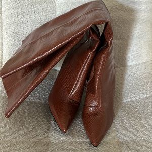 Pleather brown knee high boots! Never been worn. Zip closure.